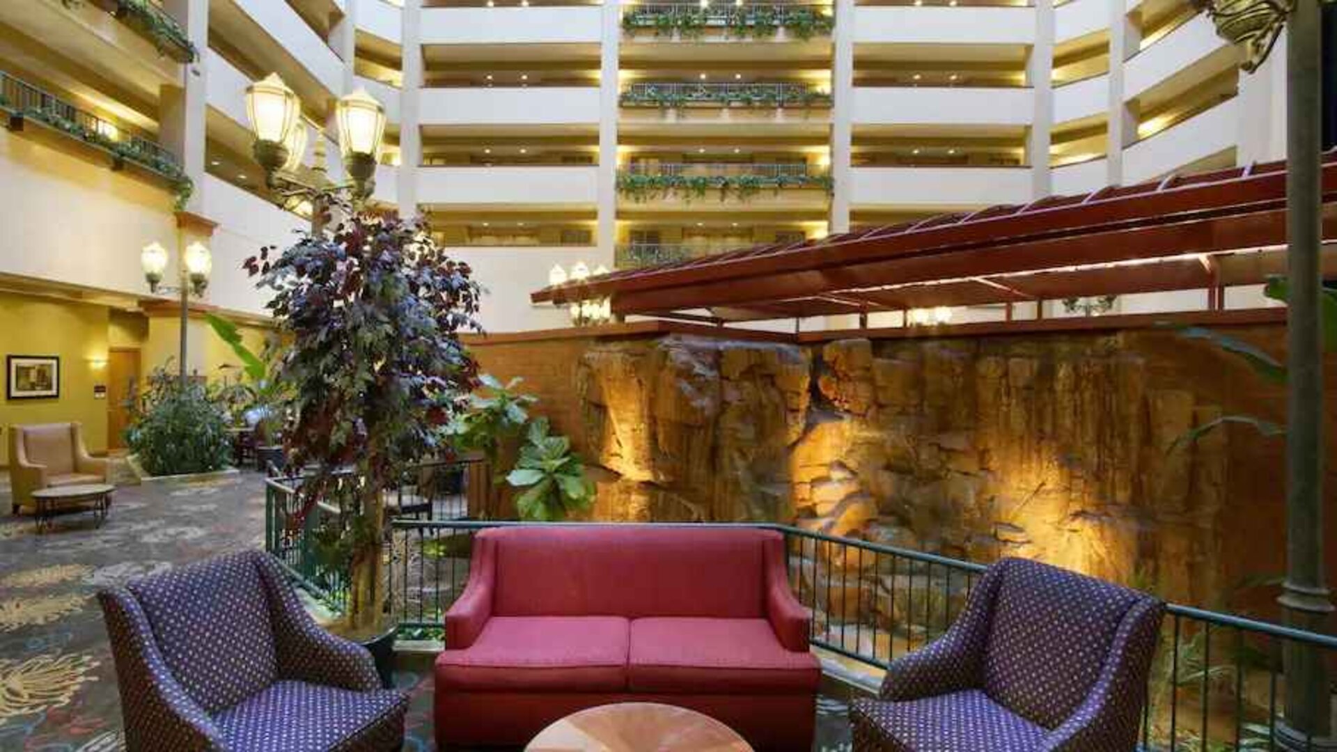 Comfortable workspace in a hotel lobby at the Embassy Suites by Hilton Charleston Airport Convention Center.