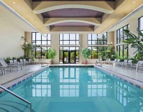 Bright hotel area with indoor pool at the Embassy Suites by Hilton Hot Springs Hotel & Spa.