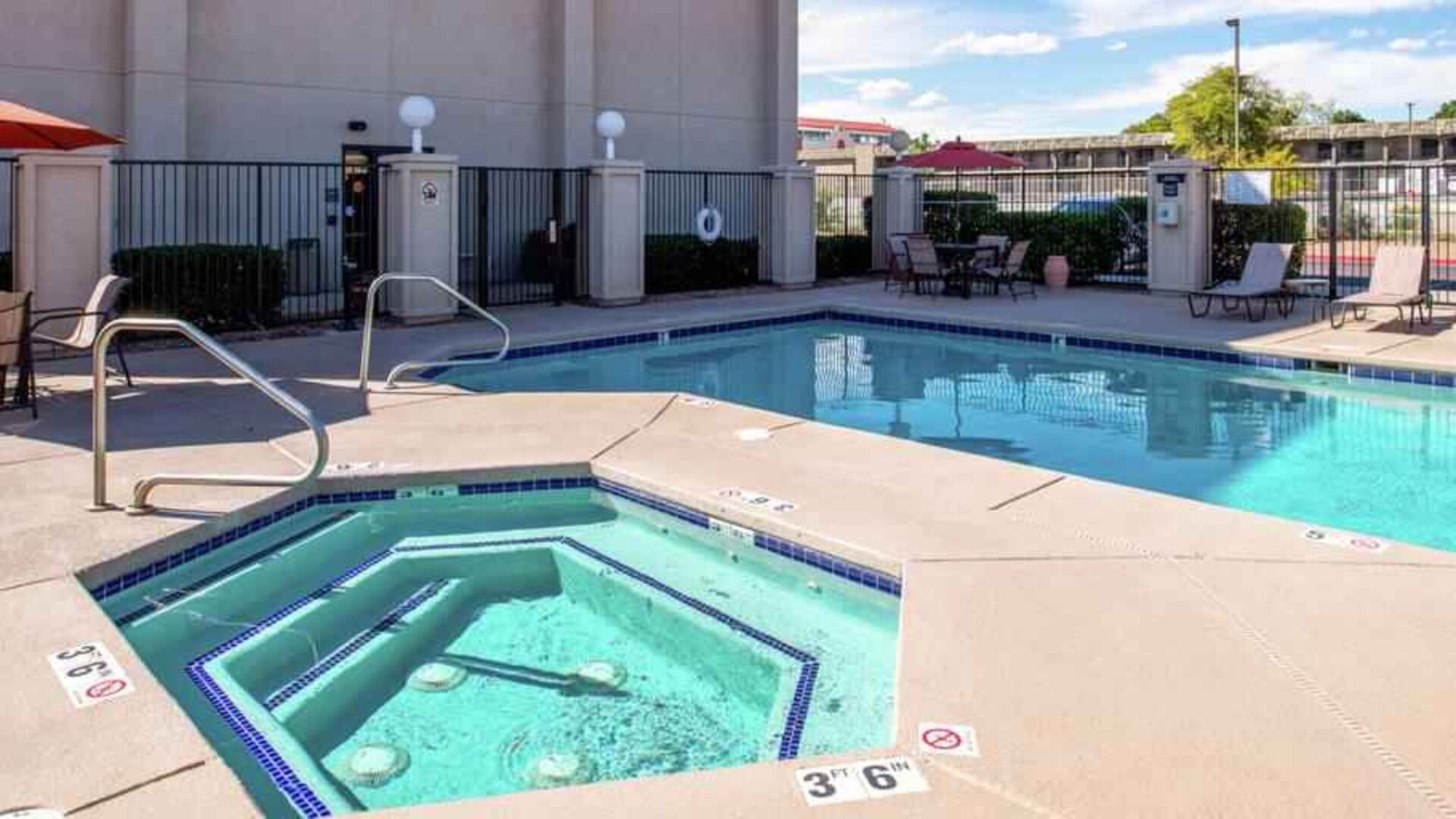 Beautiful outdoor area with two pools at the Hampton Inn Albuquerque, University-Midtown (UNM).