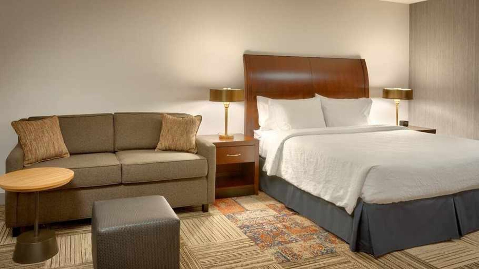 comfortable king room with lounge area at Hilton Garden Inn Salt Lake City/Sandy.