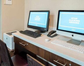 dedicated business center with printers, internet, and work desks ideal for working remotely at Embassy Suites by Hilton Seattle Downtown Pioneer Square.