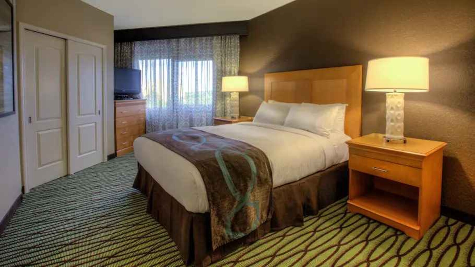 Queen suite with window at the DoubleTree Suites by Hilton Orlando - Disney Springs Area.