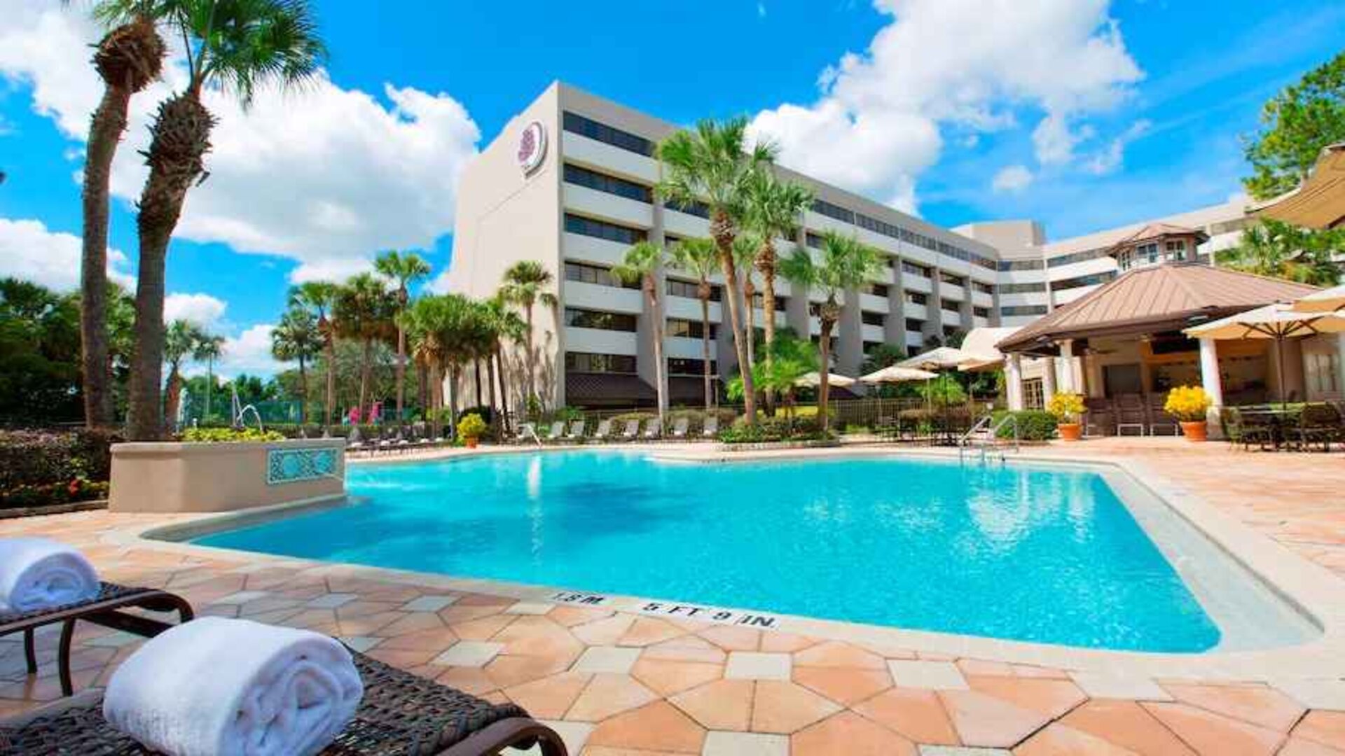 Relaxing outdoor pool at the DoubleTree Suites by Hilton Orlando - Disney Springs Area.