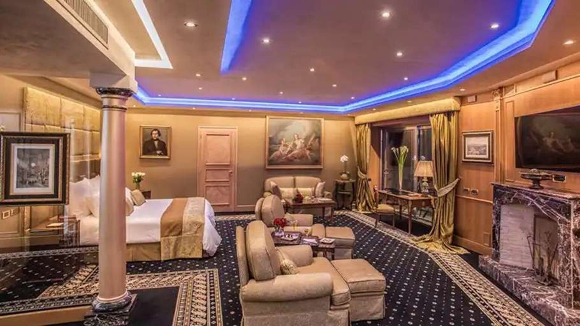 Spacious hotel suite with fireplace and working station at the Rome Cavalieri, A Waldorf Astoria Hotel.