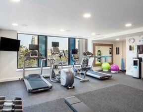 Fitness center with treadmills at the Hampton by Hilton Belfast City Centre.