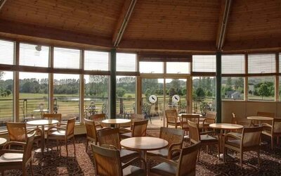 Restaurant area with view at the Hilton Belfast Templepatrick Golf & Country Club.