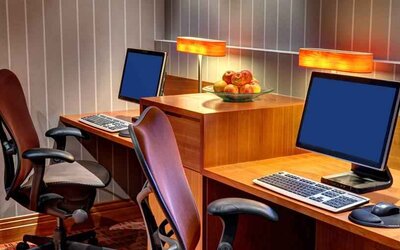 Business center with computers at the Hilton Garden Inn Frankfurt Airport.