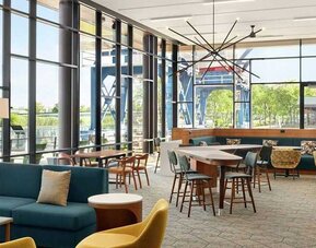 comfortable and bright-lit lounge and coworking space at Homewood Suites by Hilton Wilmington Downtown.