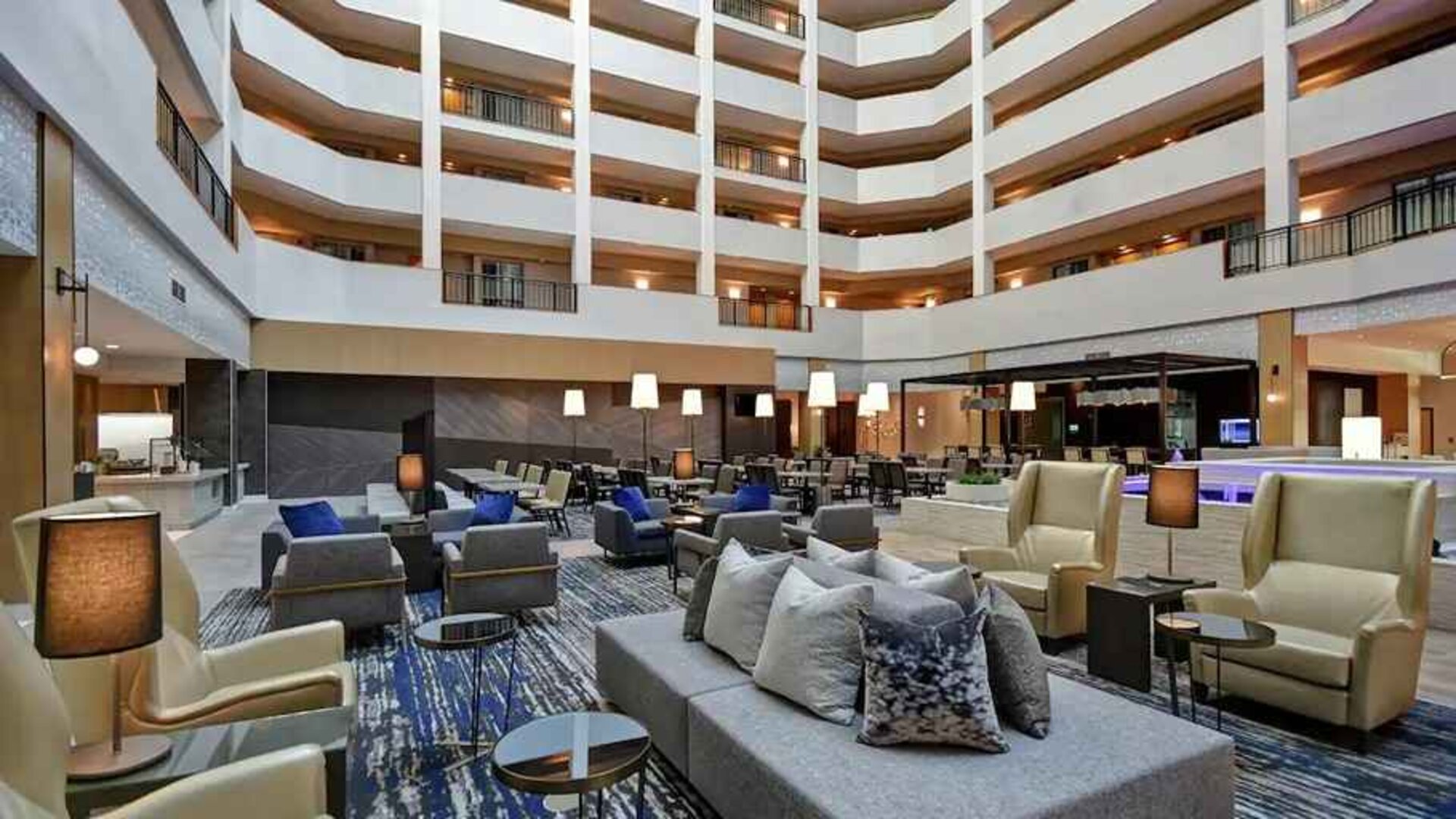 comfortable and bright-lit lounge and coworking space at Embassy Suites by Hilton Raleigh Durham Research Triangle.