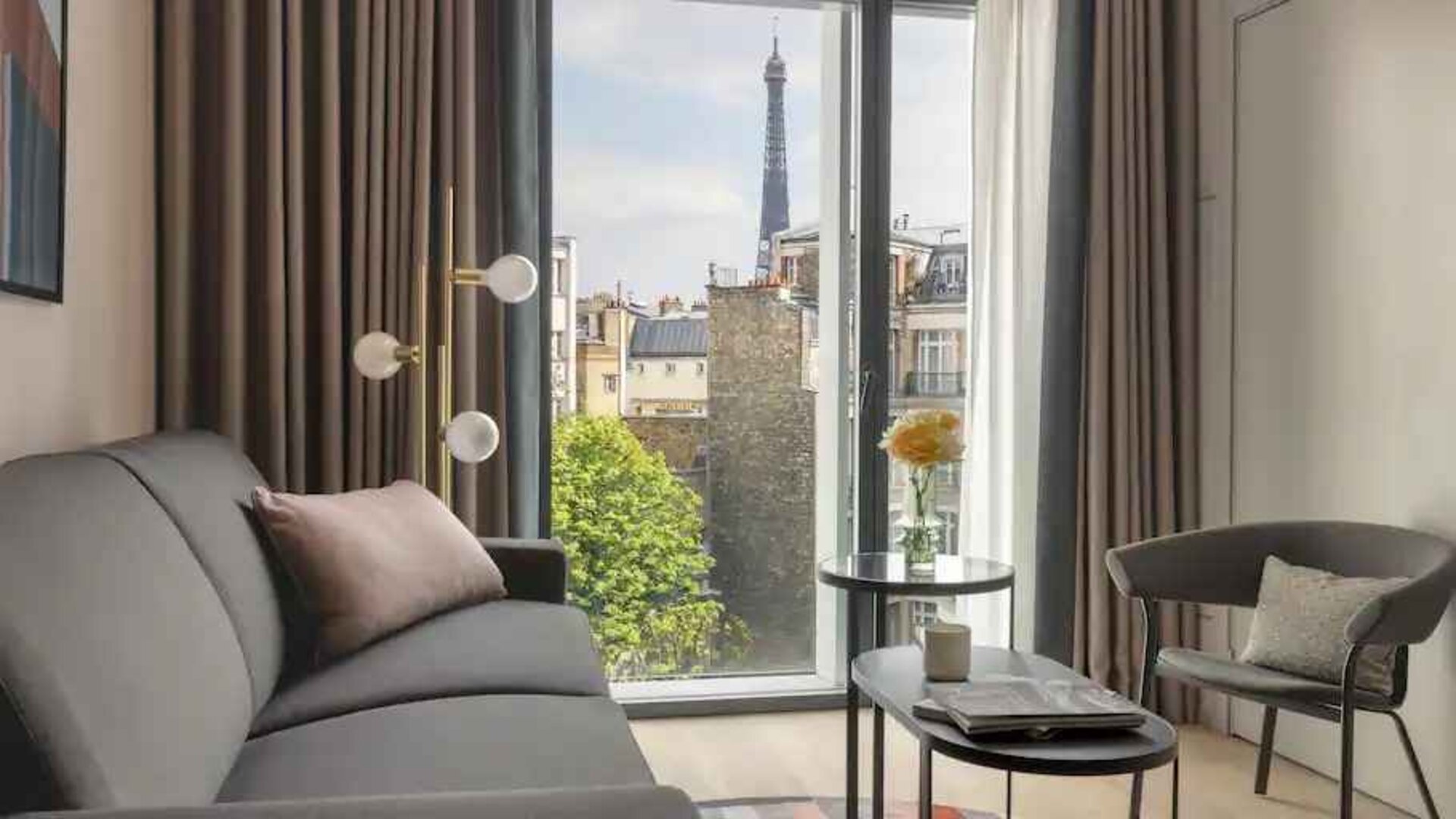 Living room overlooking the tour eiffel at the Canopy by Hilton Paris Trocadero.