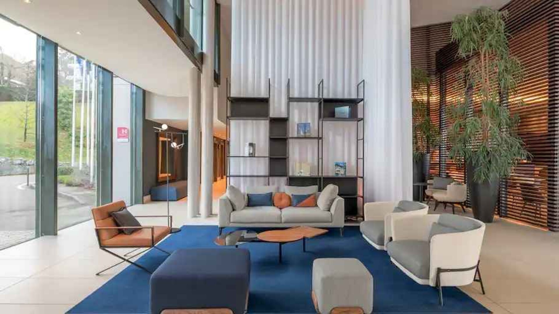 Bright lobby workspace with sofas at the Hilton Evian-les-Bains.