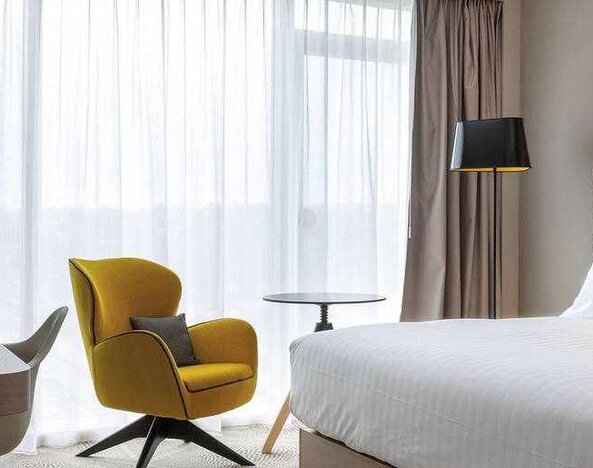 Hotel room with desk at the Hilton Garden Inn Tours Centre.