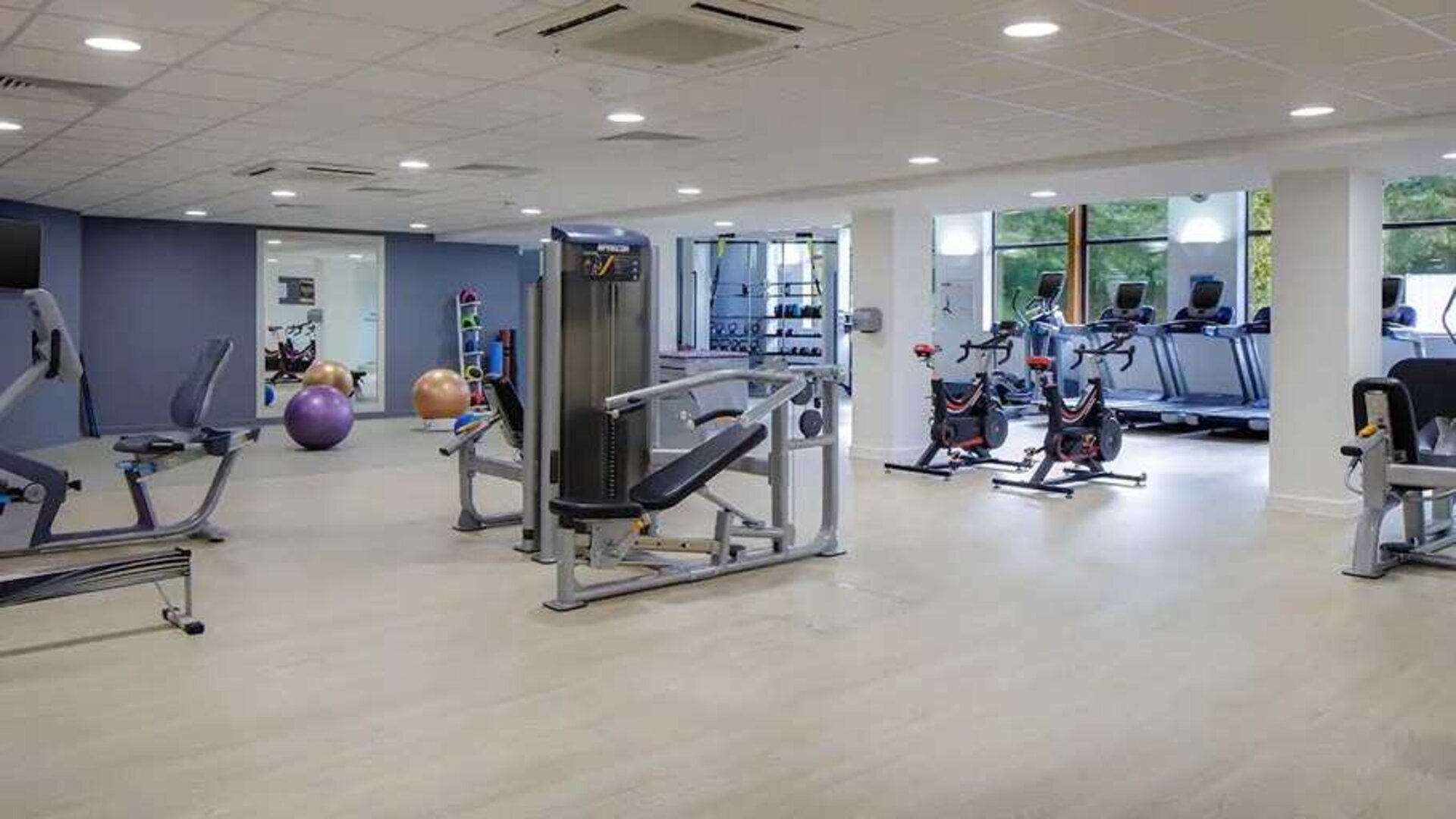 Well equipped fitness center at Hilton London Watford.