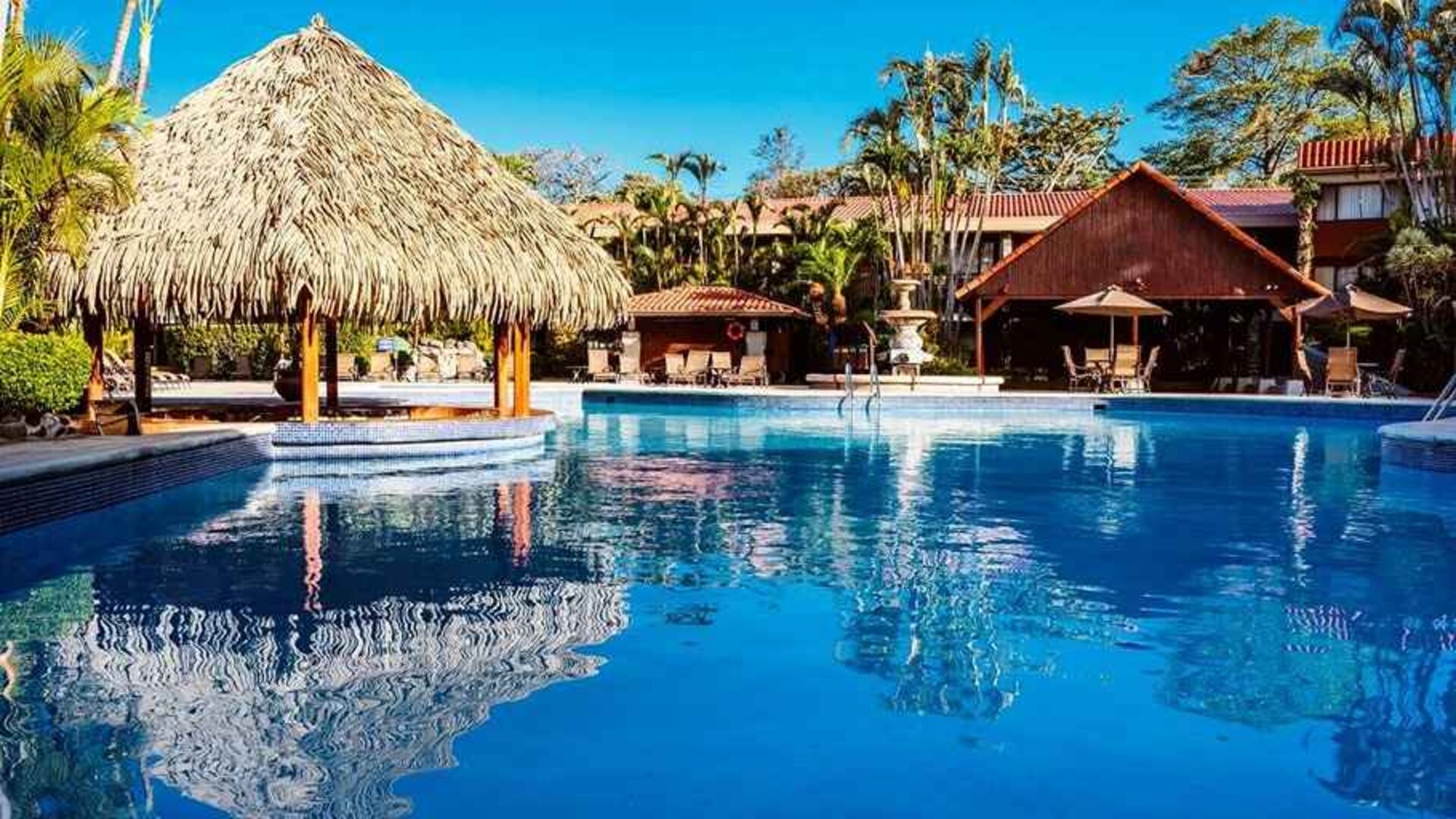 gorgeous outdoor pool with sun beds at DoubleTree by Hilton Hotel Cariari San Jose - Costa Rica.
