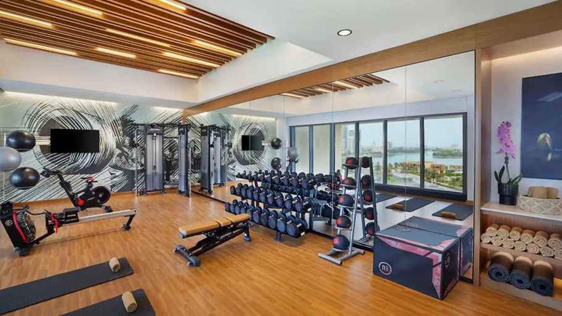 well equipped fitness center at DoubleTree by Hilton Sharjah Waterfront Hotel & Residences.