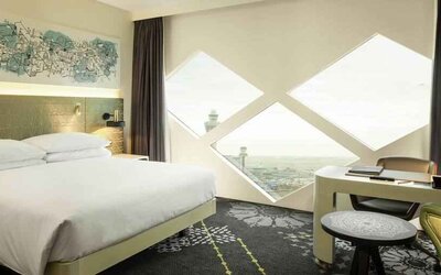 King bedroom with desk at the Hilton Amsterdam Airport Schiphol.