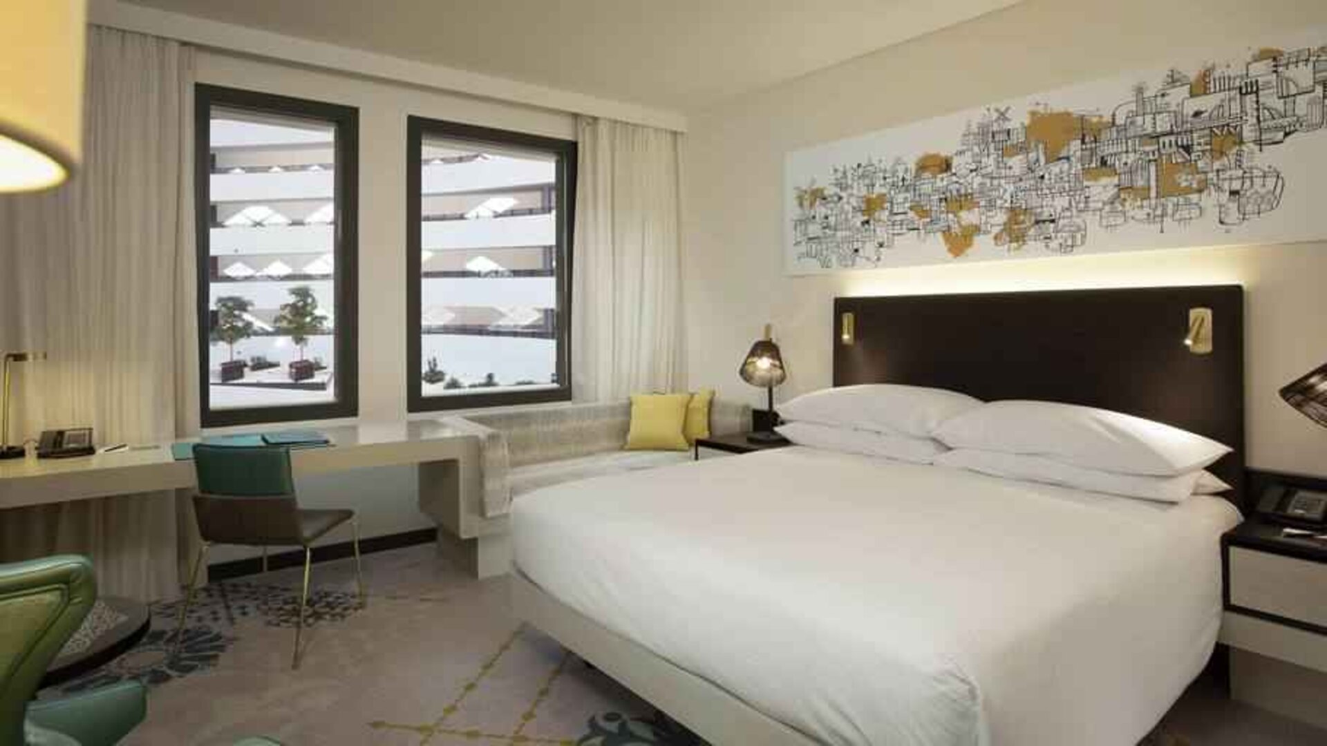 King guestroom with working station at the Hilton Amsterdam Airport Schiphol.