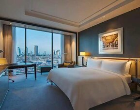 spacious king room with TV, desk, and city views at Hilton Istanbul Bomonti Hotel & Conference Center.