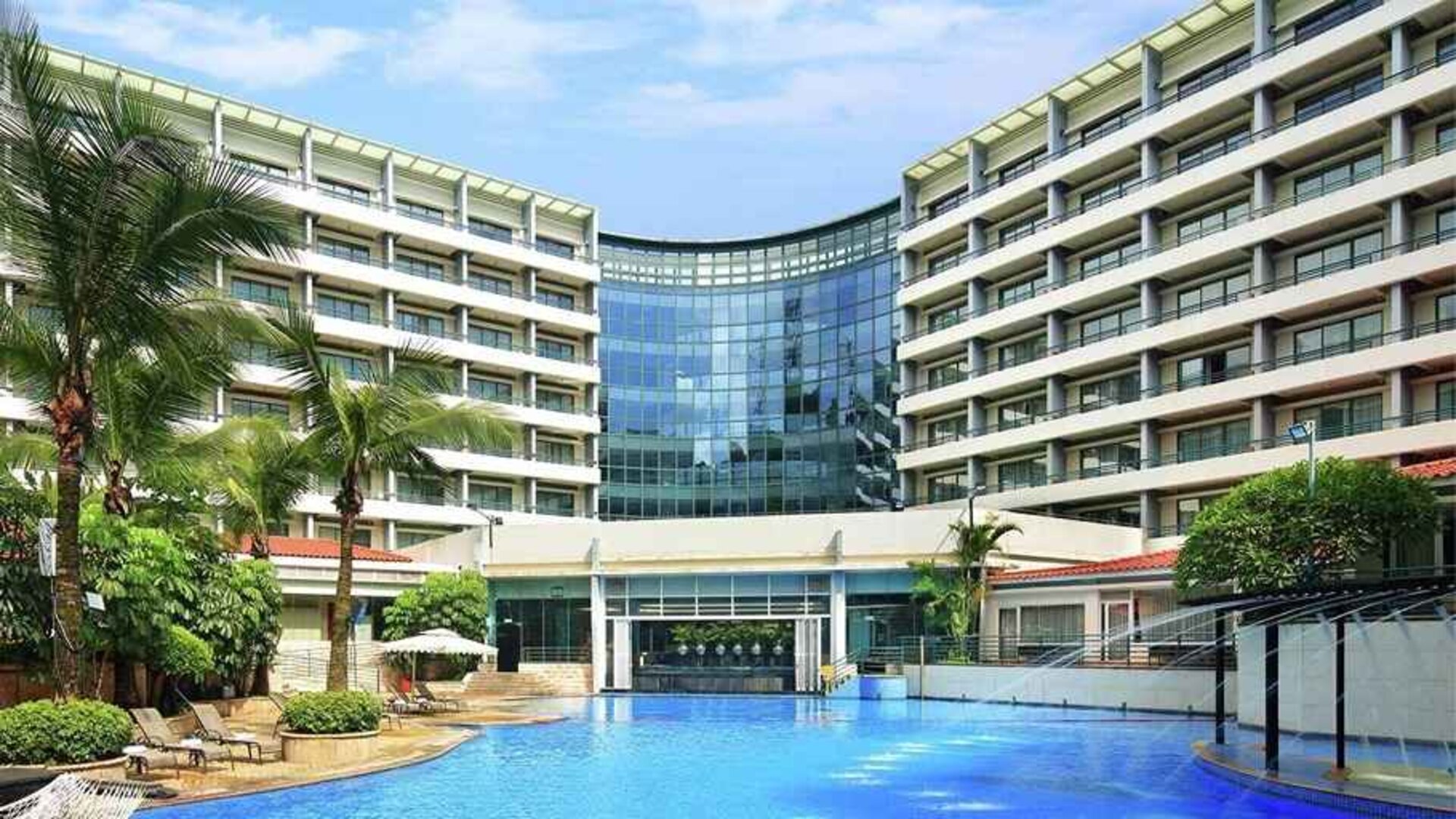 stunning outdoor pool with sunbeds at Hilton Guangzhou Science City.