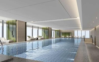 beautiful indoor pool large enough to do laps, surrounded by sun beds at DoubleTree by Hilton Kunming Airport.
