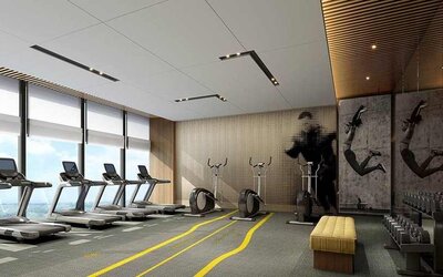 well equipped fitness center with lots of natural light at DoubleTree by Hilton Kunming Airport.