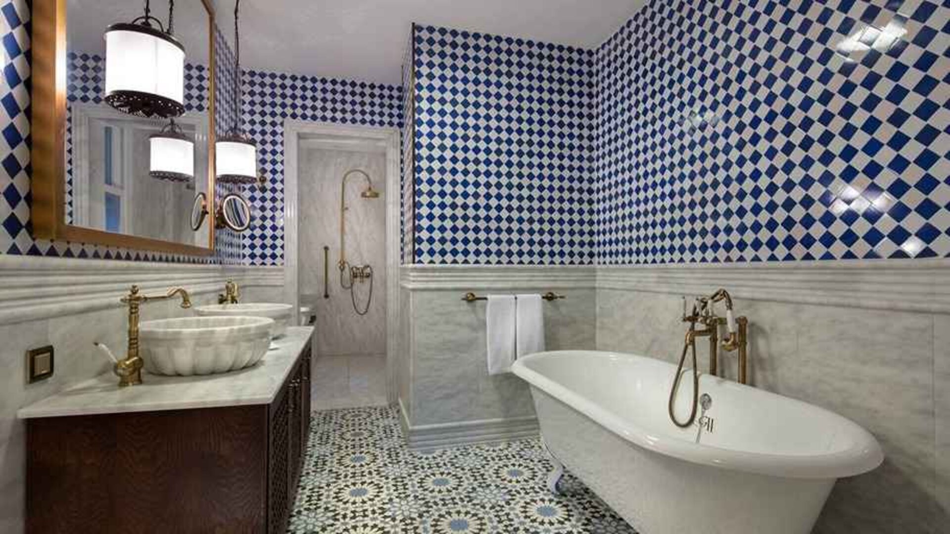 clean and spacious bathroom with bath and shower at Hagia Sofia Mansions Istanbul, Curio Collection by Hilton.