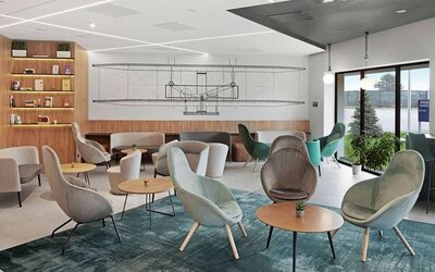 comfortable lobby and coworking space at Hilton Garden Inn Bucharest Airport.