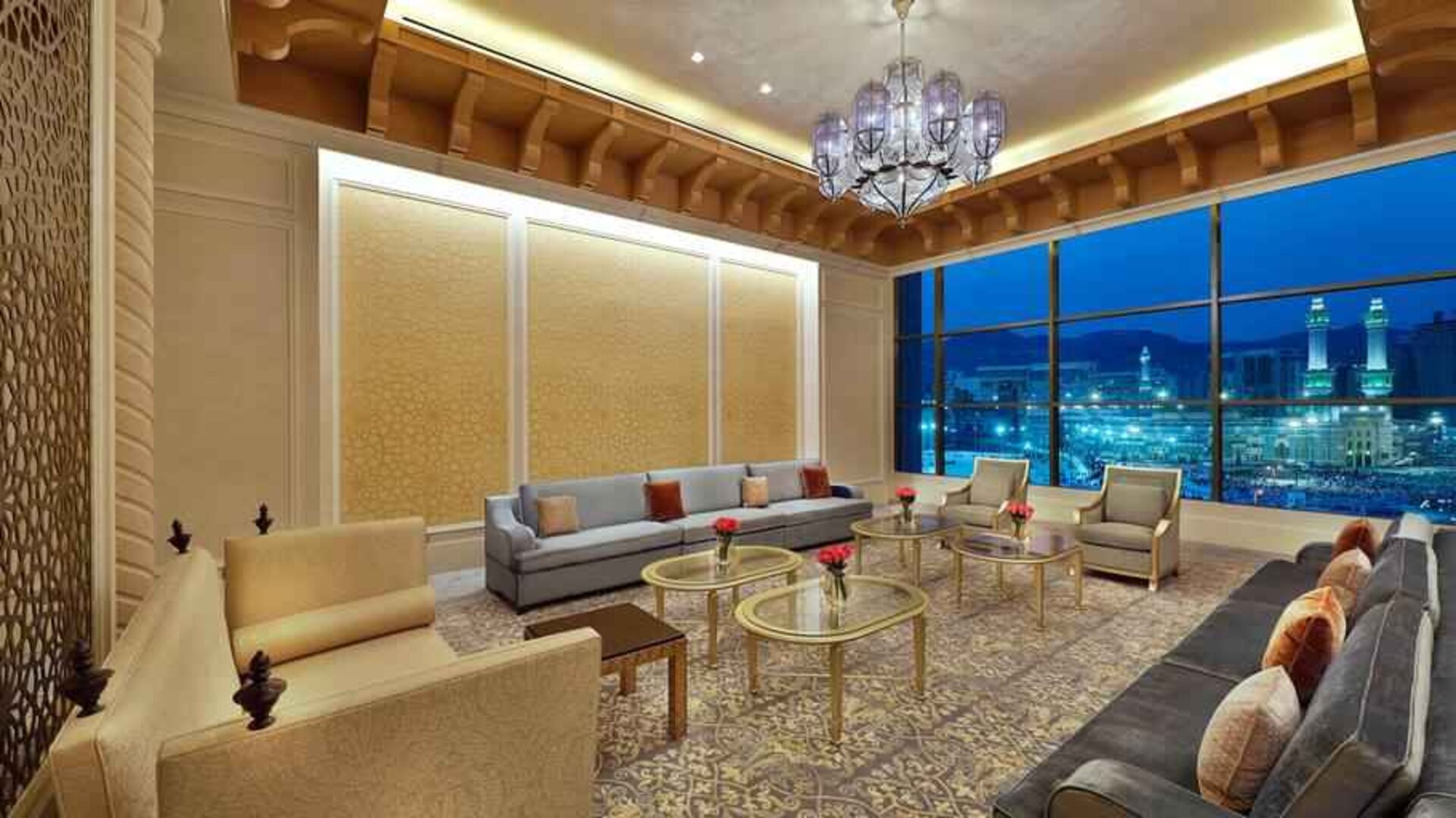 Seating area with large window and view at the Hilton Makkah Convention Hotel.