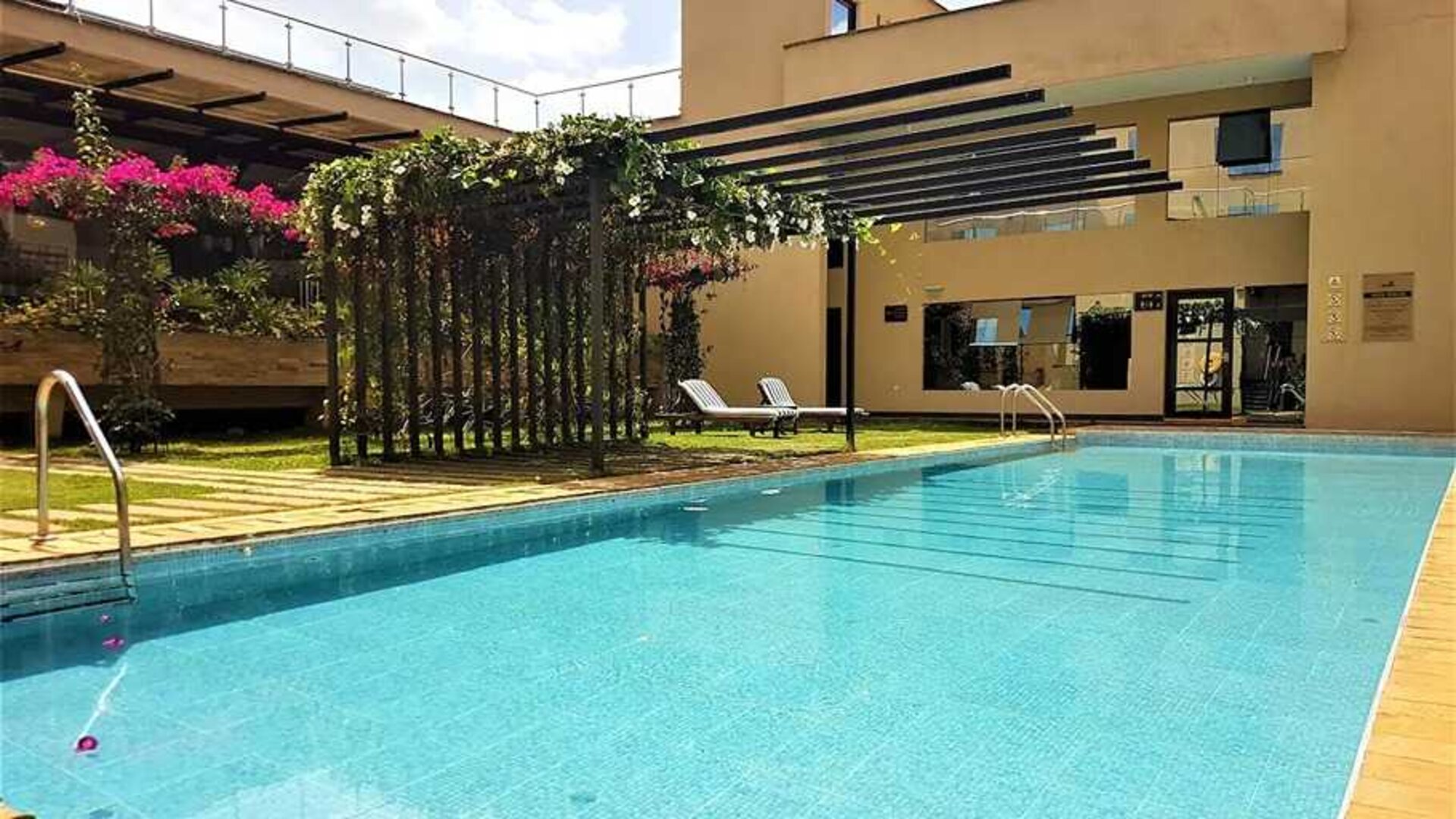 lovely outdoor pool with sun beds at DoubleTree by Hilton Nairobi Hurlingham.