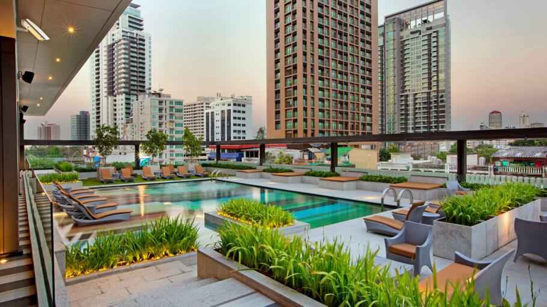 Outdoor pool area suitable as workspace at the DoubleTree by Hilton Sukhumvit Bangkok.