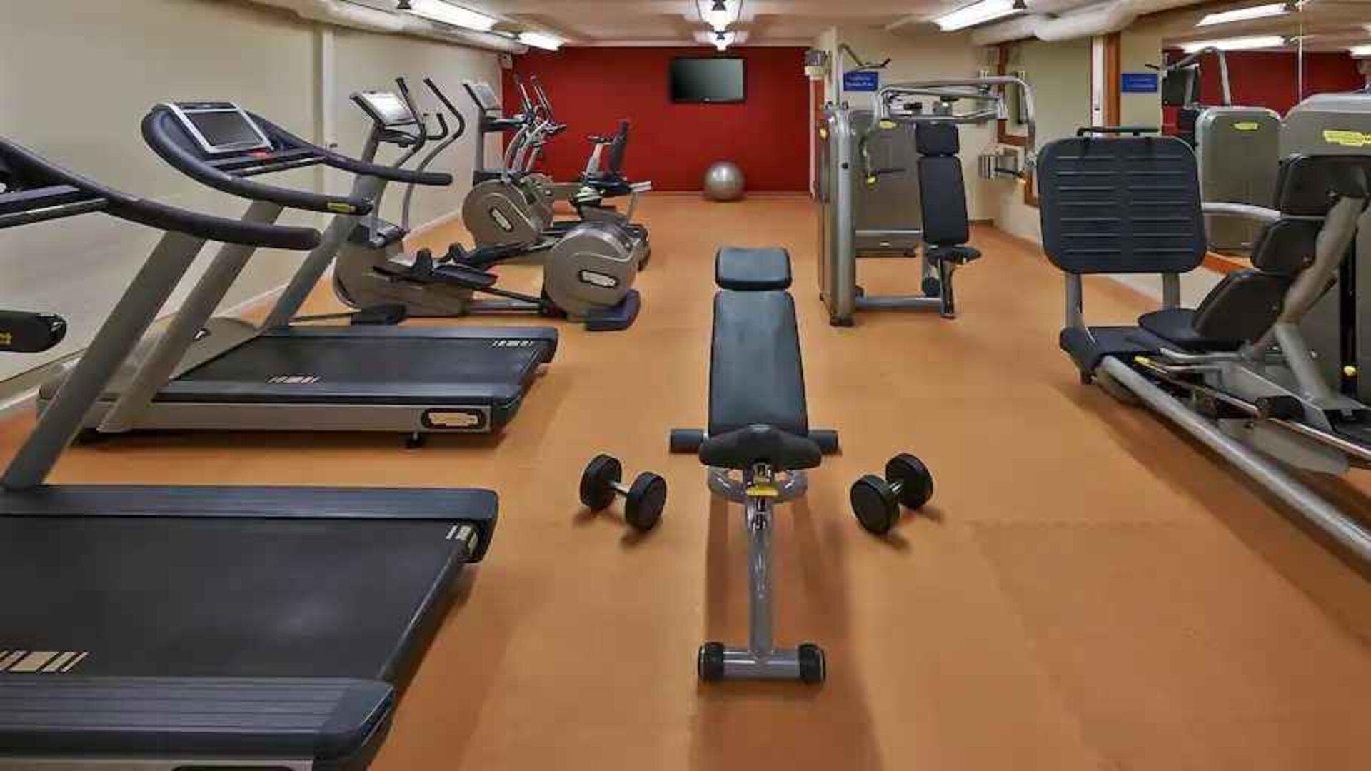 Fitness center with treadmills and machines at the Hilton Zurich Airport.