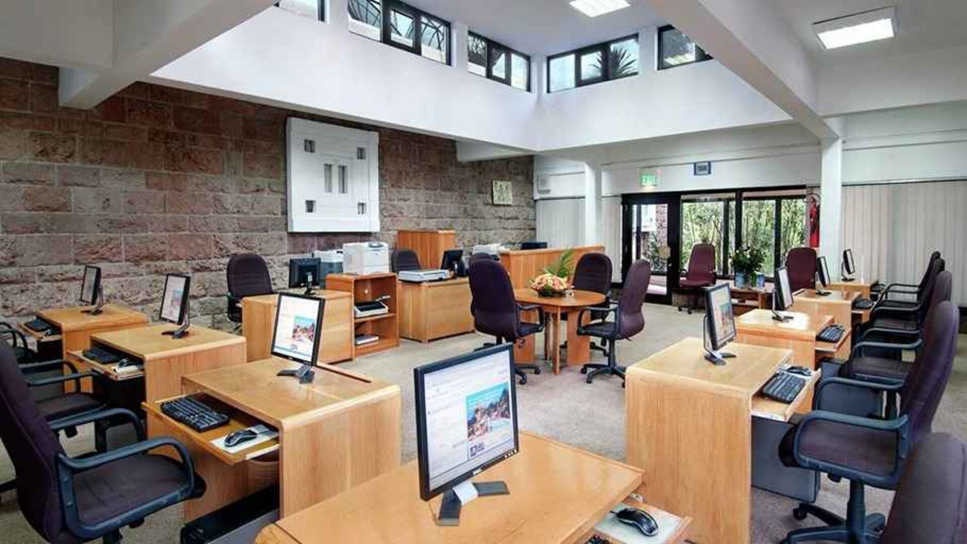 dedicated business center and workspace with PCs, internet, printers, and business desks at Hilton Addis Ababa.