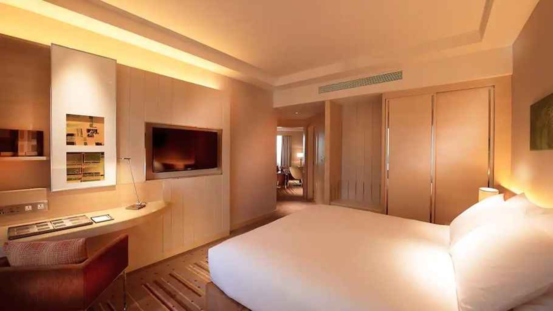 delux king room with TV, work desk, and chair at DoubleTree by Hilton Hotel Johor Bahru.