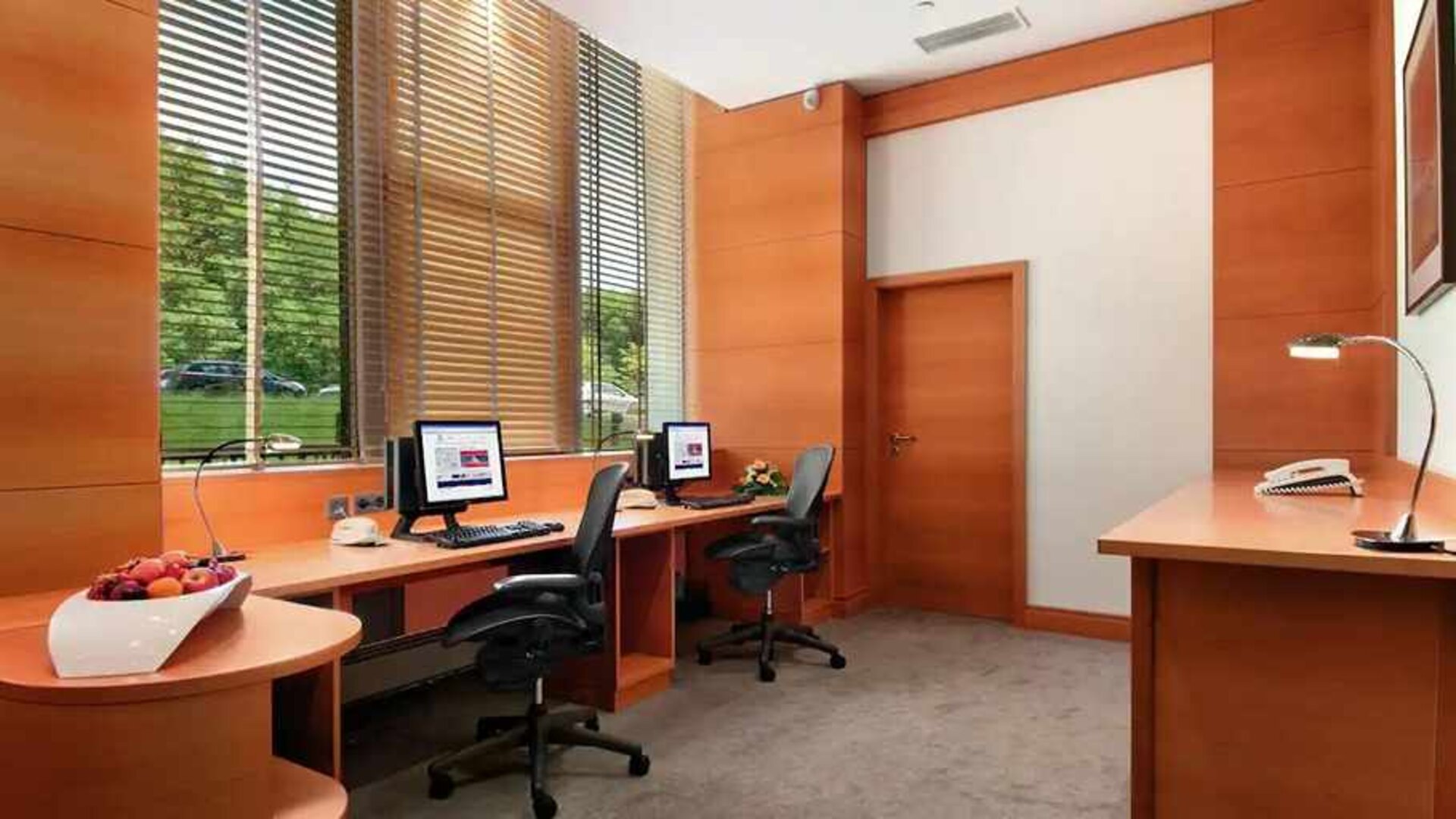 dedicated business center with PC, internet, desk, chair, and printer ideal for working remotely at DoubleTree by Hilton Luxembourg.
