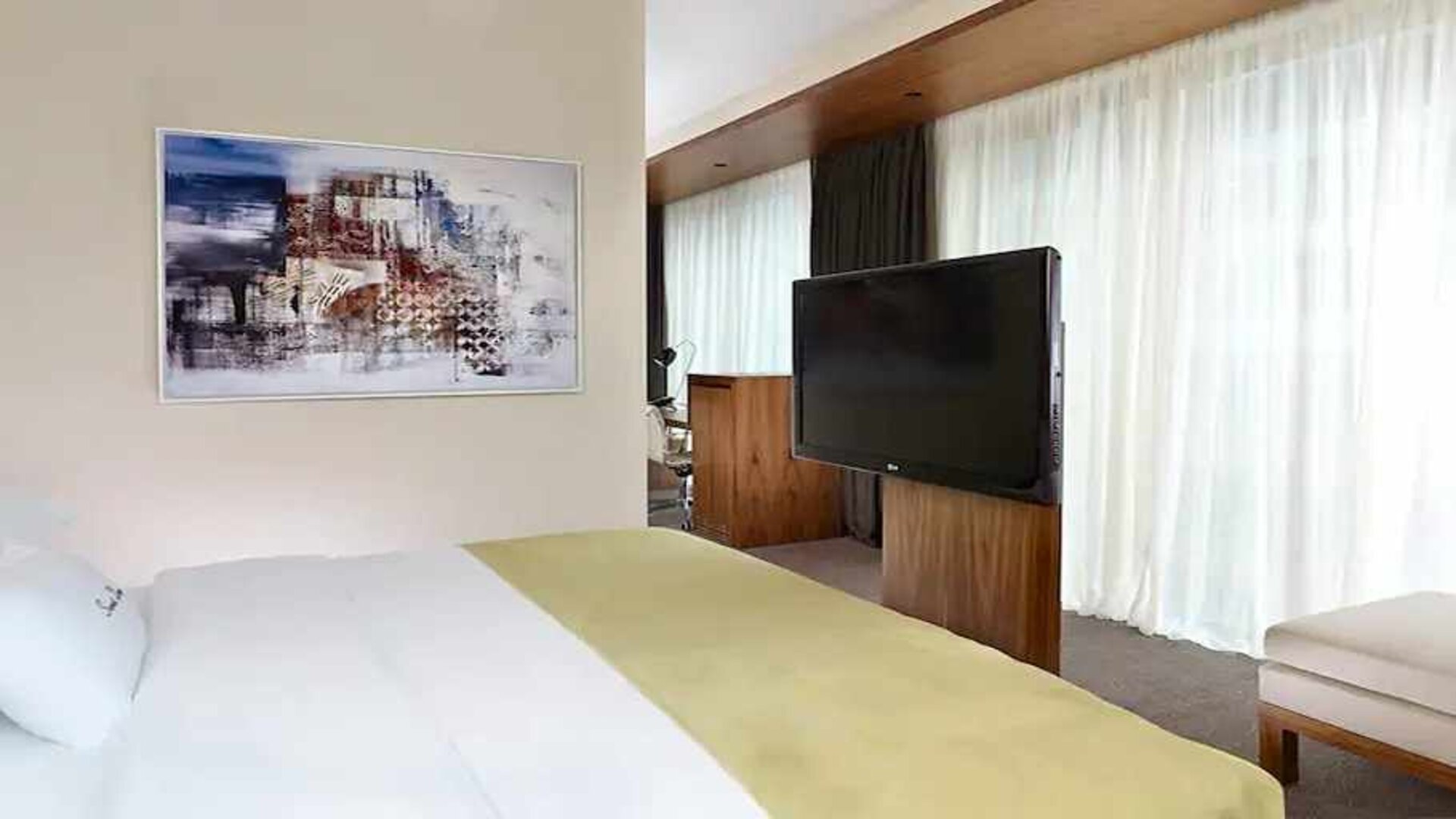 comfortable king room with TV at DoubleTree by Hilton Zagreb.