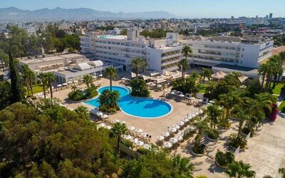stunning outdoor pool surrounded with sunbeds and umbrellas at Hilton Nicosia.