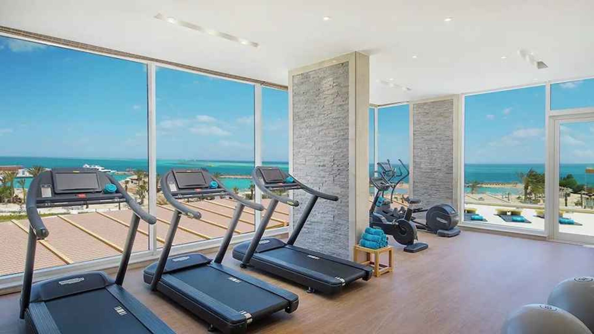 well equipped fitness center with ocean views at Hilton Hurghada Plaza.