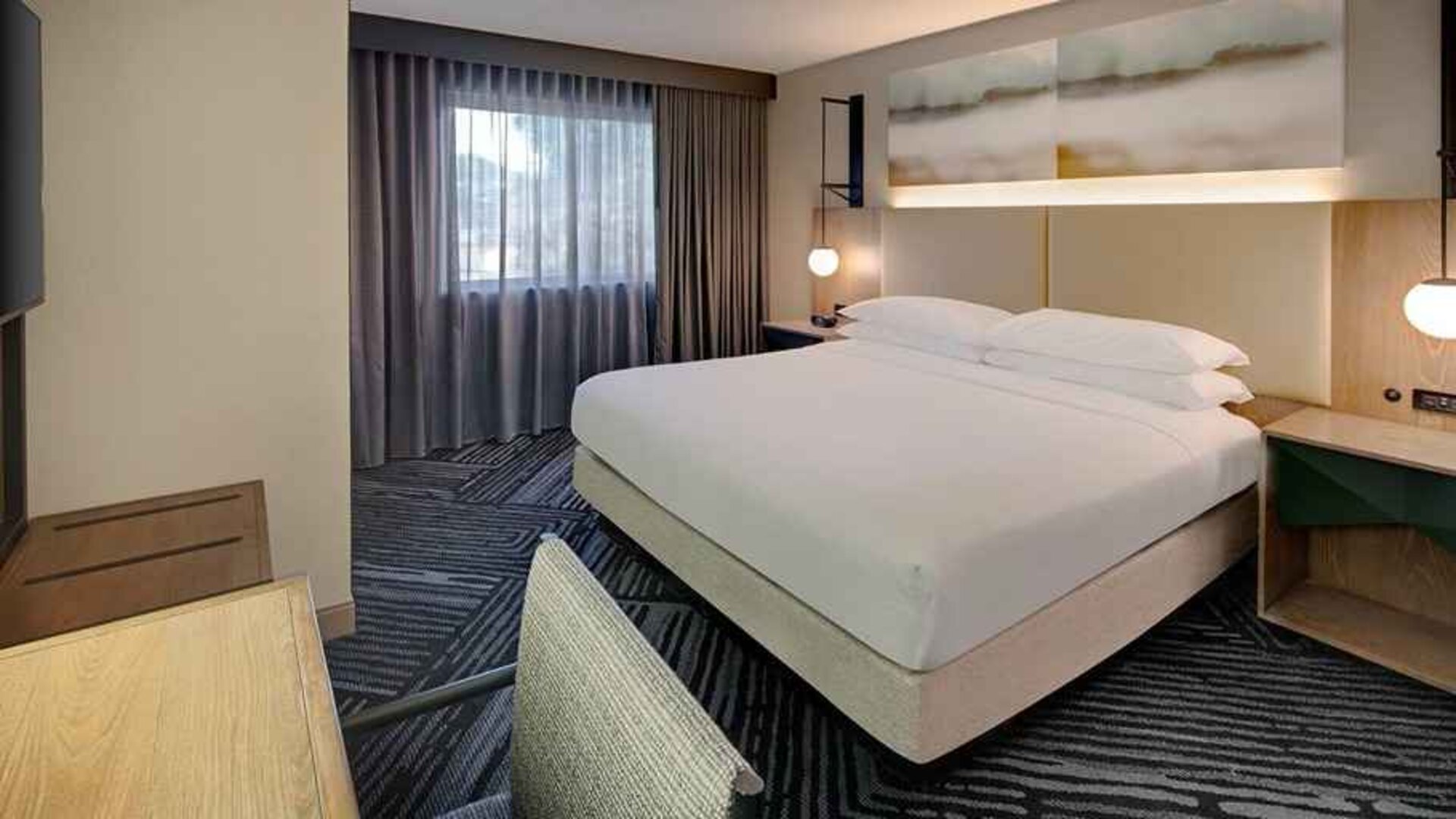 spacious king room with work area and business desk at Embassy Suites by Hilton San Rafael Marin County.