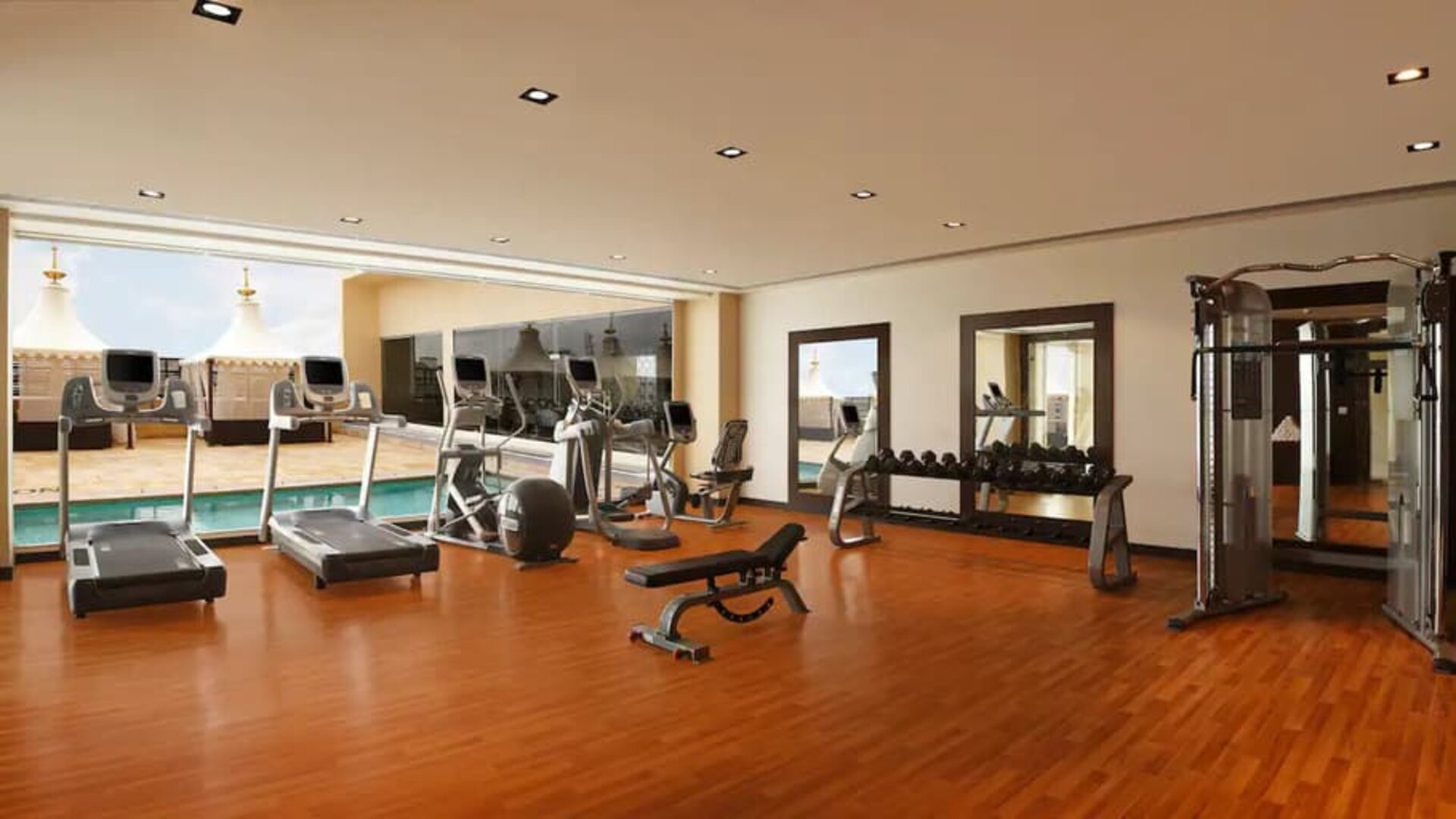 Exercise room with treadmills, free weights, weigth machines, and plenty of space to stretch out and do yoga.
