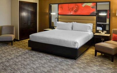 spacious king suite with comfortable couches at Hilton Garden Inn Guatemala City.