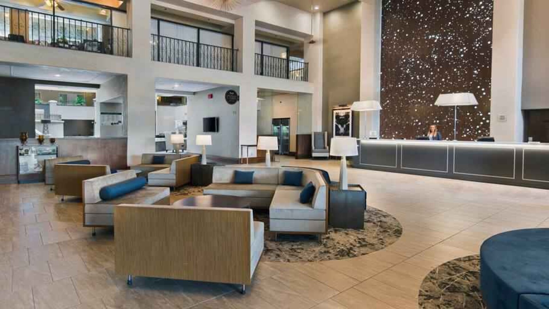 Lobby workspace with sofas at the Embassy Suites by Hilton Los Angeles Downey.