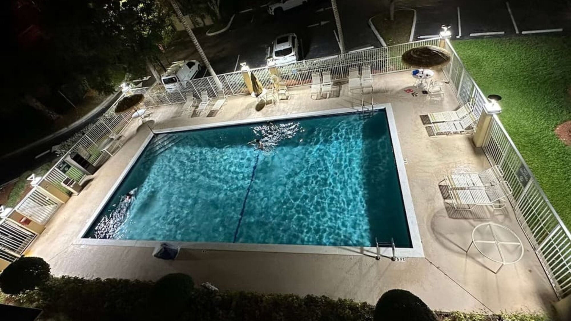 Outdoor swimming pool surrounded by lounge seating, offering guests a relaxing place to unwind and enjoy Florida's warm weather at La Quinta Inn & Suites By Wyndham Sawgrass Mills.