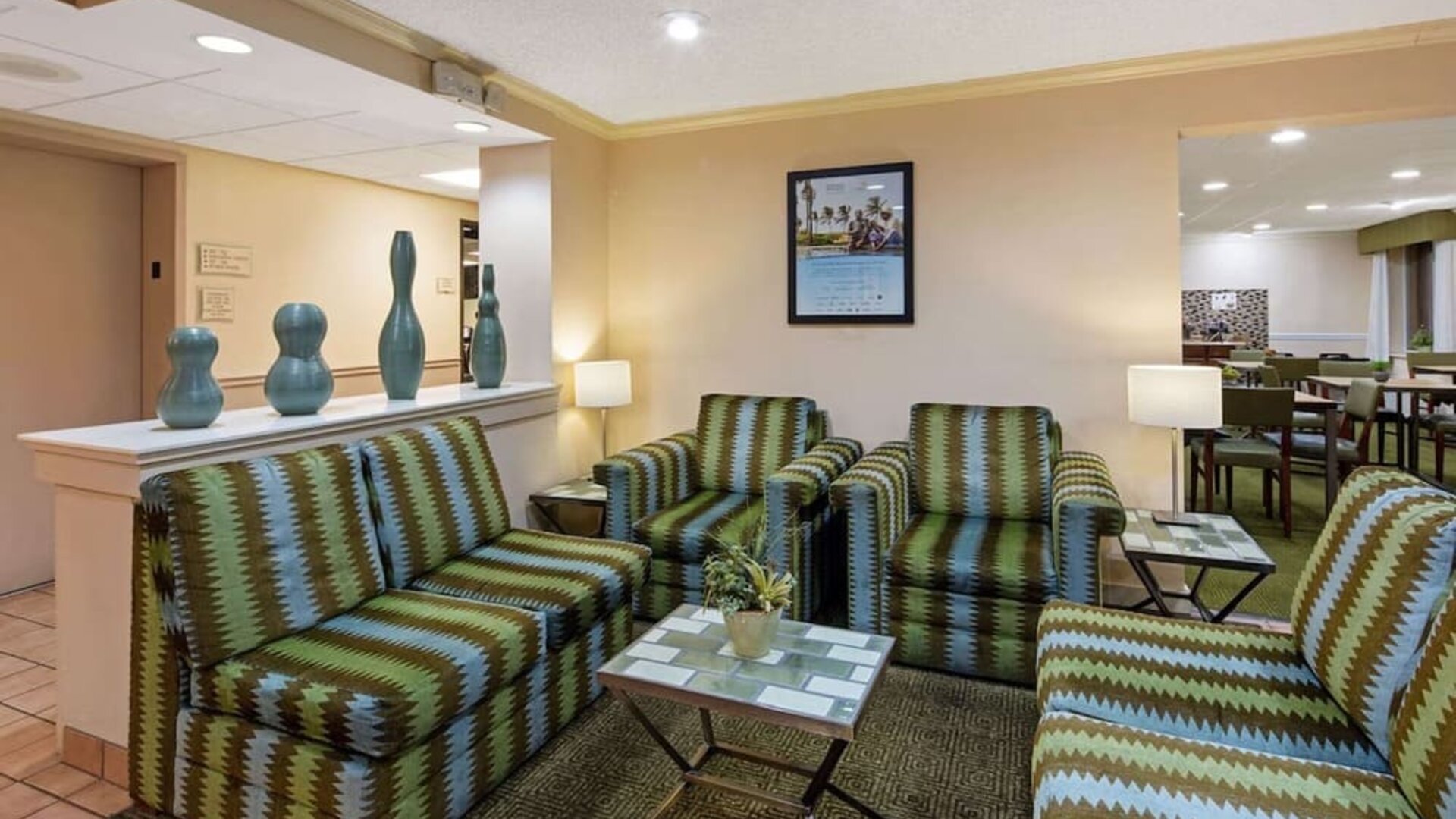 Cozy lobby seating area with comfortable furnishings, providing guests with a welcoming space to relax or meet with friends and colleagues.