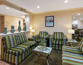 Cozy lobby seating area with comfortable furnishings, providing guests with a welcoming space to relax or meet with friends and colleagues.