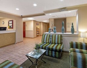 Reception and lobby area featuring guest services, comfortable seating, and easy access to hotel amenities and dining facilities.