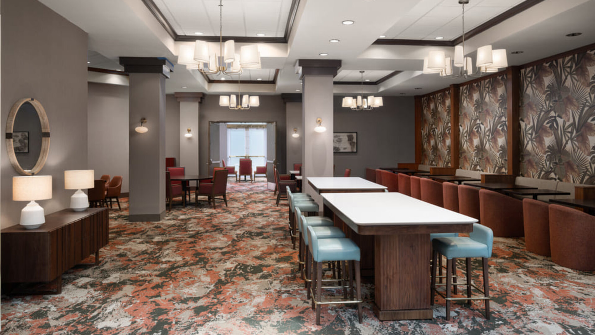 Hotel dining area featuring contemporary seating, open spaces, and a welcoming environment for guests at Embassy Suites By Hilton Charleston Airport Convention Center.