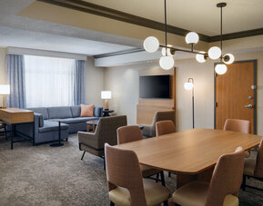 Open seating and lounge space, offering stylish furnishings and a welcoming environment at Embassy Suites By Hilton Charleston Airport Convention Center.