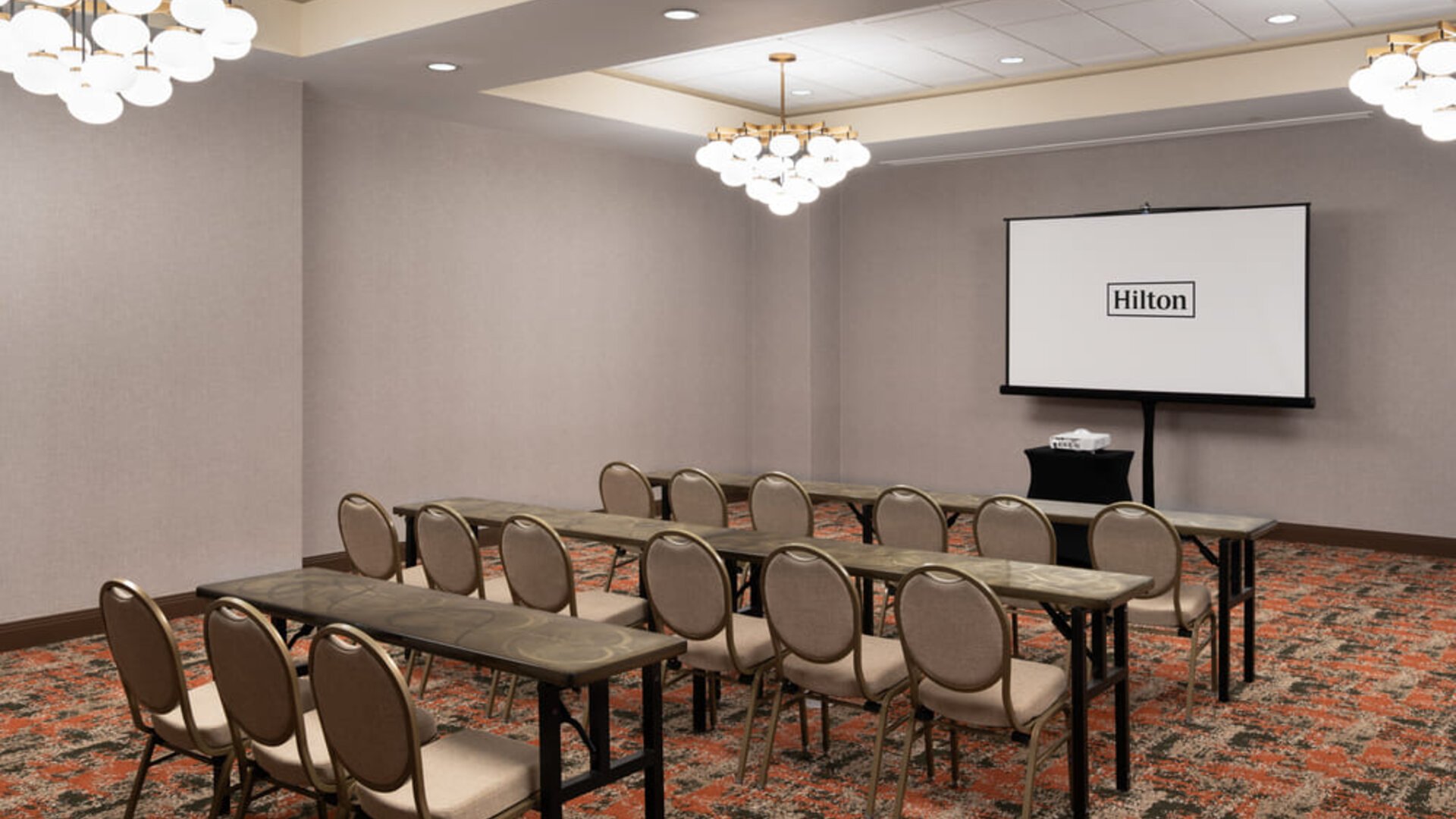 Flexible event and meeting room equipped for presentations, training sessions, and business gatherings at Embassy Suites By Hilton Charleston Airport Convention Center.