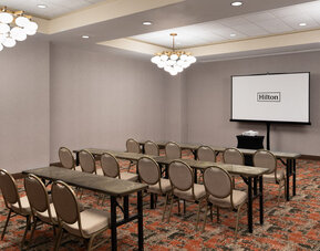 Flexible event and meeting room equipped for presentations, training sessions, and business gatherings at Embassy Suites By Hilton Charleston Airport Convention Center.