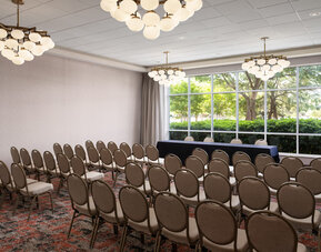 Conference and event space arranged in theater style, ideal for presentations, seminars, and corporate events at Embassy Suites By Hilton Charleston Airport Convention Center.